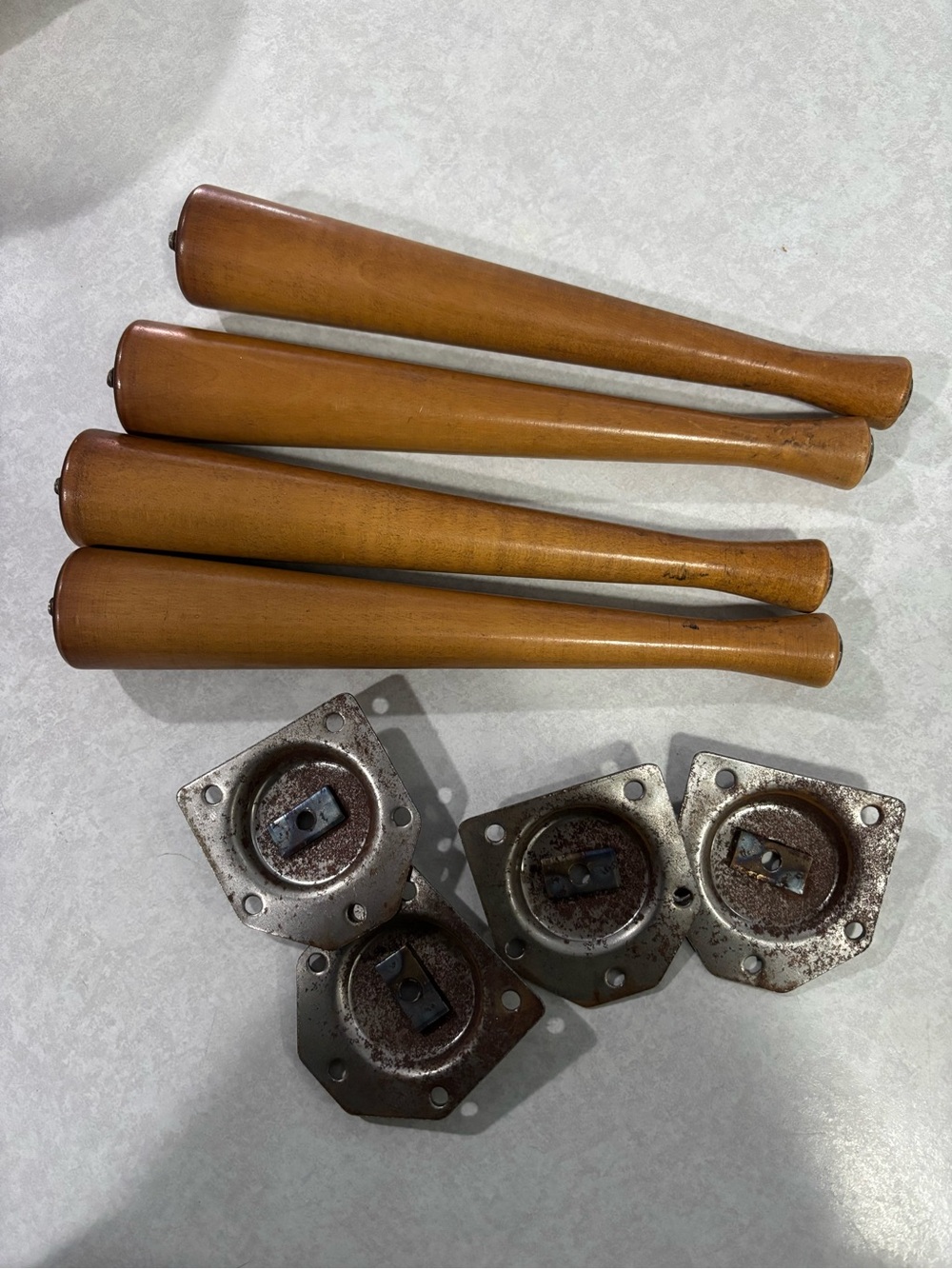 Four 10” furniture legs with metal plates they screw into.